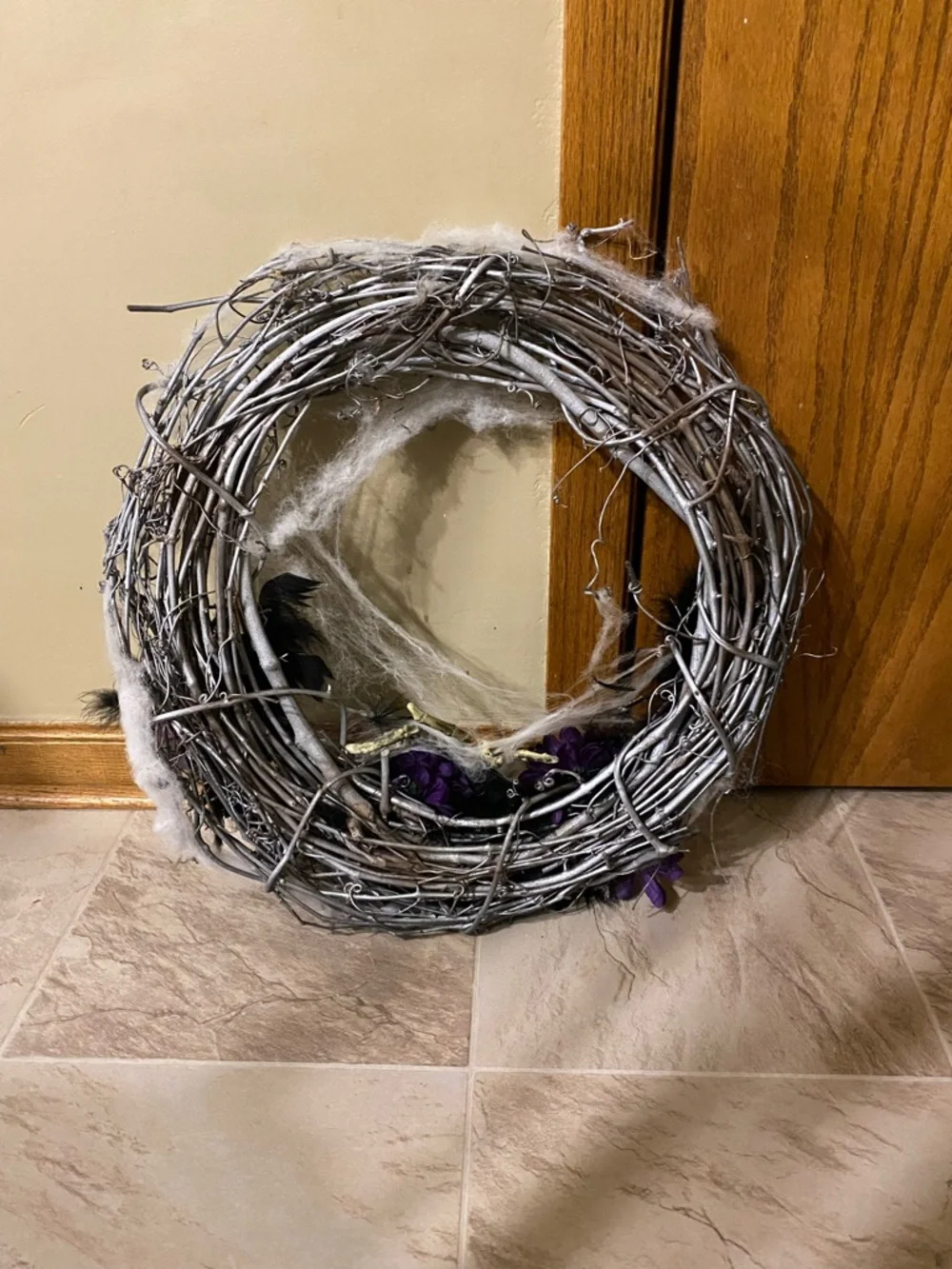 Halloween wreath with spider skeleton, flowers and cobwebs
